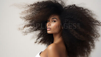 Portrait of young african woman with curly afro hair. Hair care, make-up and hair health