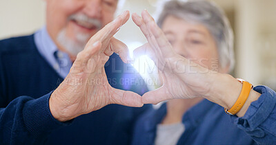 Heart, hands and senior couple with love, trust and hope in their home bonding, relax and free. Gratitude, care and old people with thank you, finger or emoji frame for kindness, security or trust