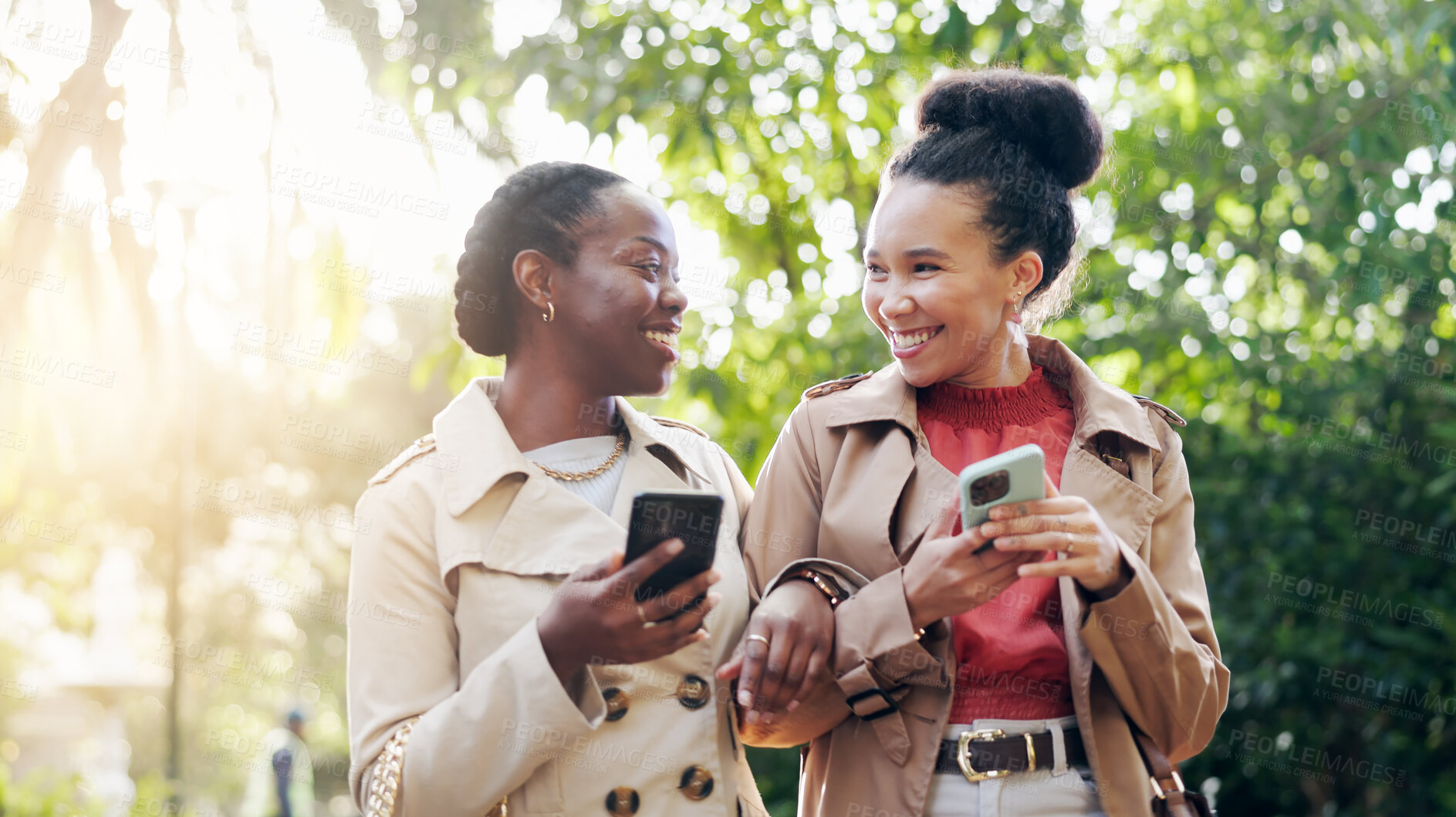 Buy stock photo Phone, social media and woman friends outdoor walking in the park together during summer with flare. Smile, fashion influencer and young content creator people in a garden for mobile communication