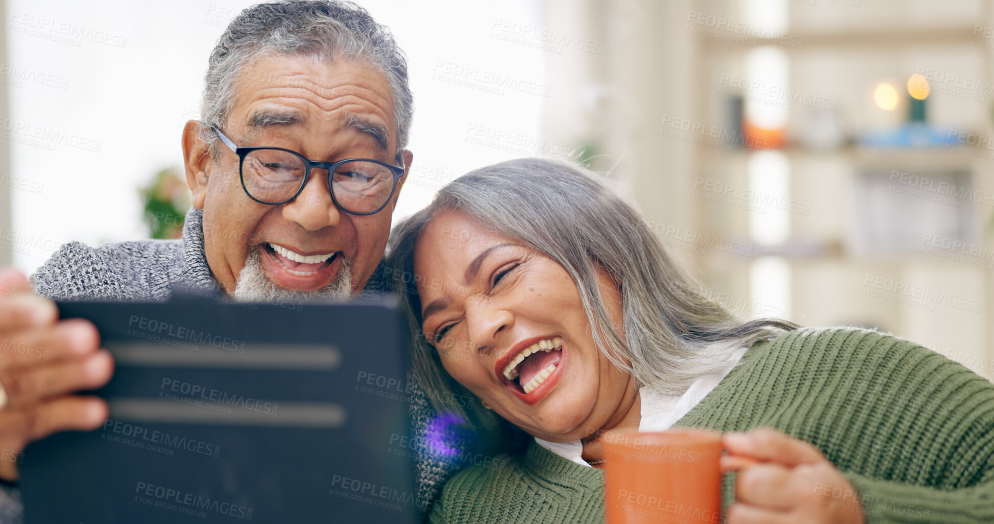Buy stock photo Tablet, smile and senior couple with retirement, home and coffee with humor, happiness and cheerful. Apartment, elderly woman and old man with technology, tea and laughing with social media and app