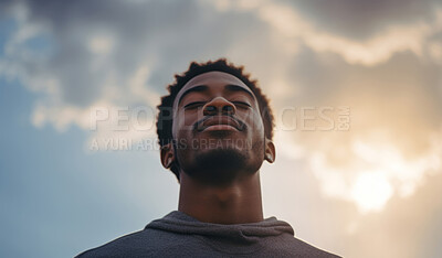 Close-up portrait of young black male. Eyes closed. Peaceful, prayer.