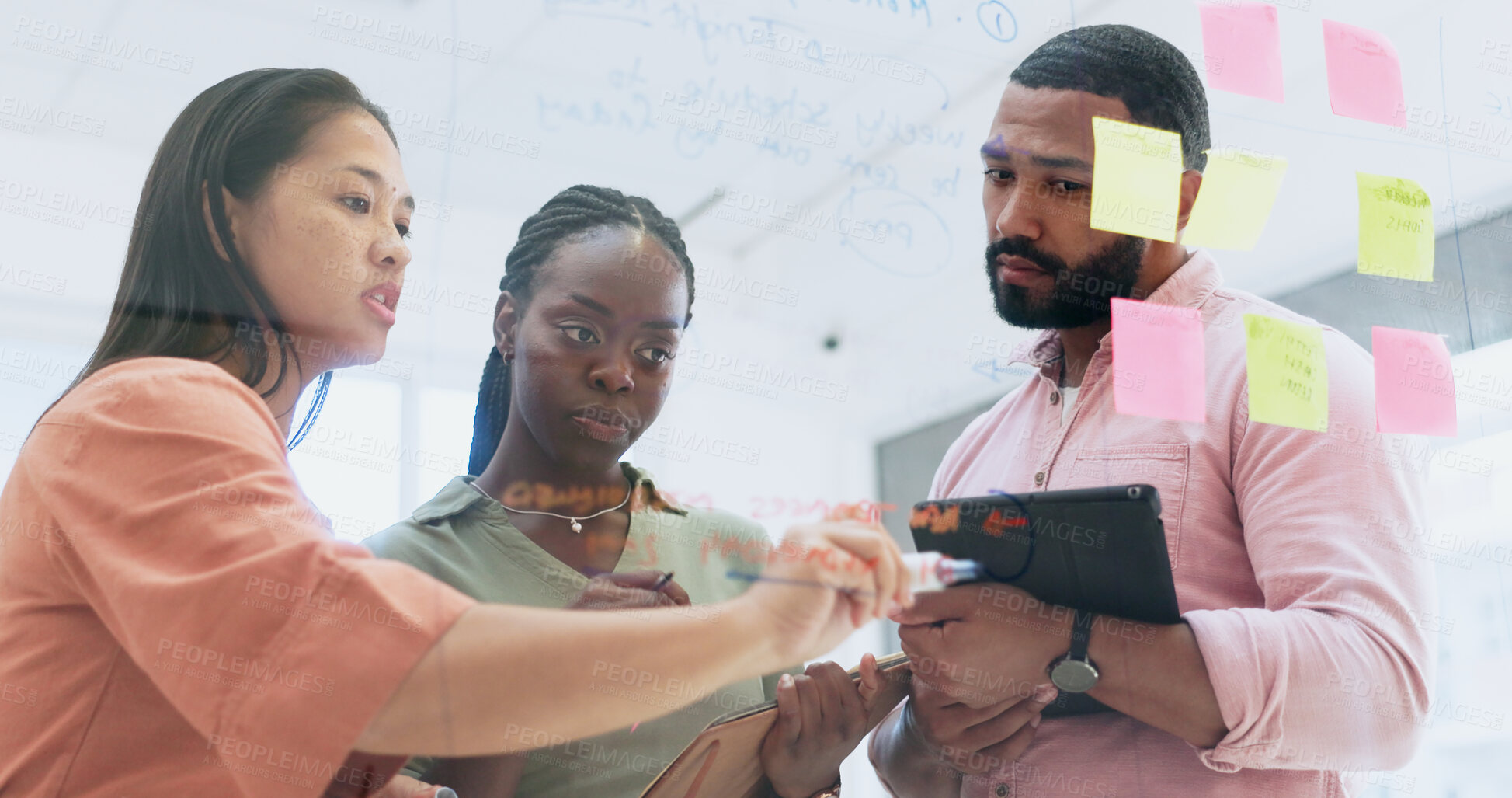 Buy stock photo Business people, teamwork and writing in planning, meeting or schedule notes for strategy on glass board at office. Group of employees in team brainstorming, ideas or reminder for agenda at workplace