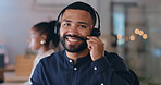 Portrait, smile and man at call center on headphones for crm support on bokeh at night. Face, happy sales agent on mic and telemarketing consultant, customer service professional or worker in office