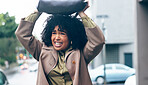 Rain, woman and bag in city for safety. security and shield with frustrated, sad or mad expression. Winter, african person and handbag on head for cover, water drops or protection in Cape Town road