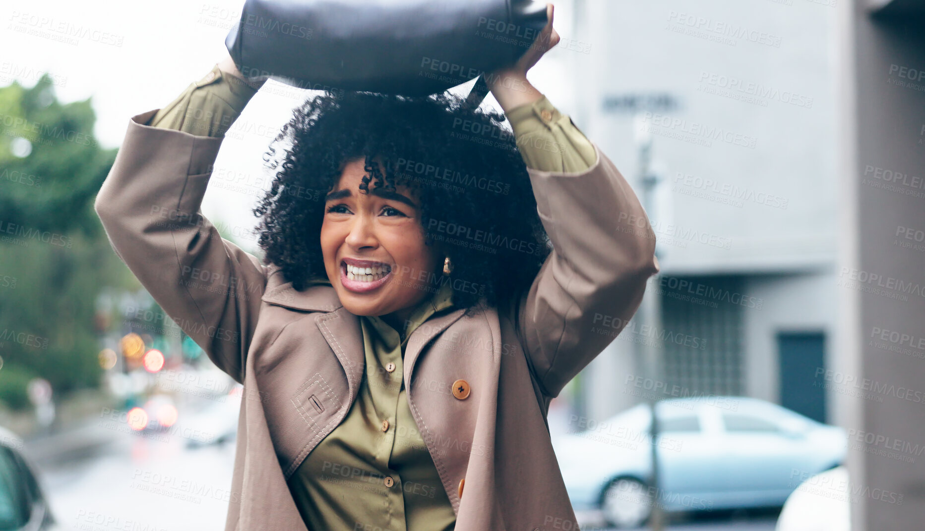 Buy stock photo Rain, woman and bag in city for safety. security and shield with frustrated, sad or mad expression. Winter, african person and handbag on head for cover, water drops or protection in Cape Town road