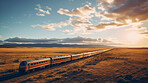 Passenger train seen travelling through countryside at sunset. Beautiful nature. Travel concept.