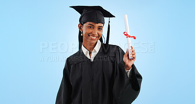 Graduate woman, diploma and portrait in studio with pride, success and achievement by blue background. Graduation, girl and certificate with award, celebration or paperwork for future from university