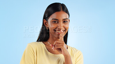 Buy stock photo Secret, portrait and woman with finger on lips, gossip and announcement with emoji on a blue background. Person, face or model with privacy, mockup space or drama news with surprise, whisper or shush