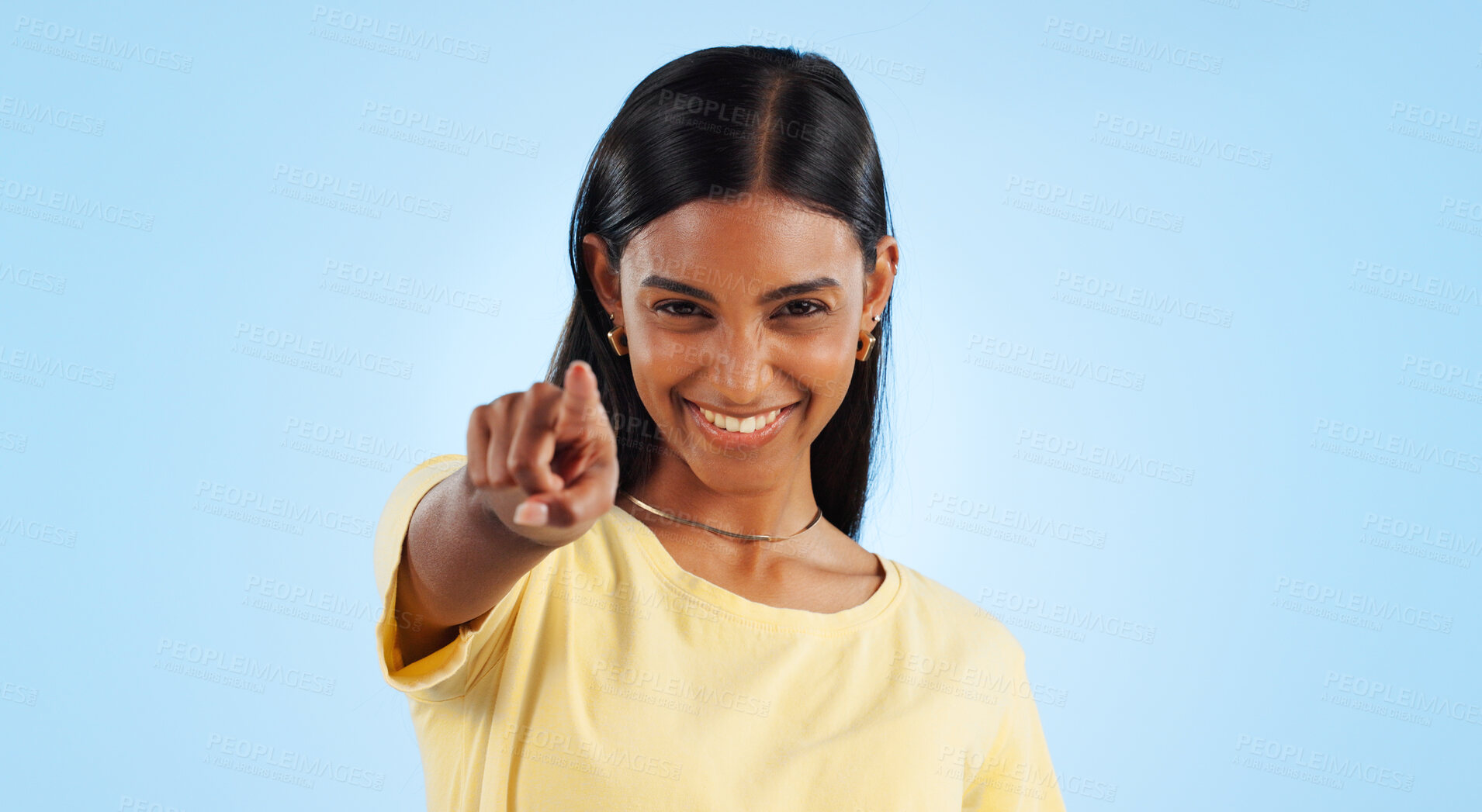 Buy stock photo Portrait, pointing to you and woman with motivation, emoji and reaction with happiness on a blue background. Face, happy person and model with hand gesture, mockup space and winning with support