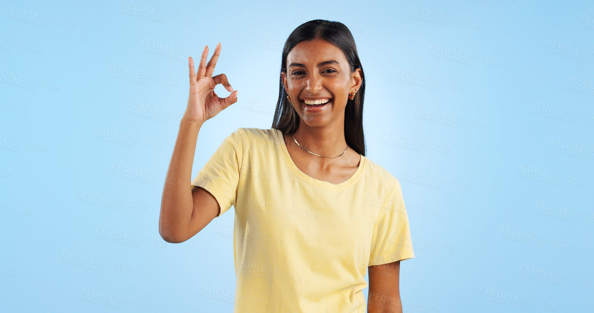 Buy stock photo Happy woman, OK hand gesture and agreement for success or support, smile and mockup space on blue background. Like, yes and emoji with feedback, vote or opinion in studio with thank you or praise
