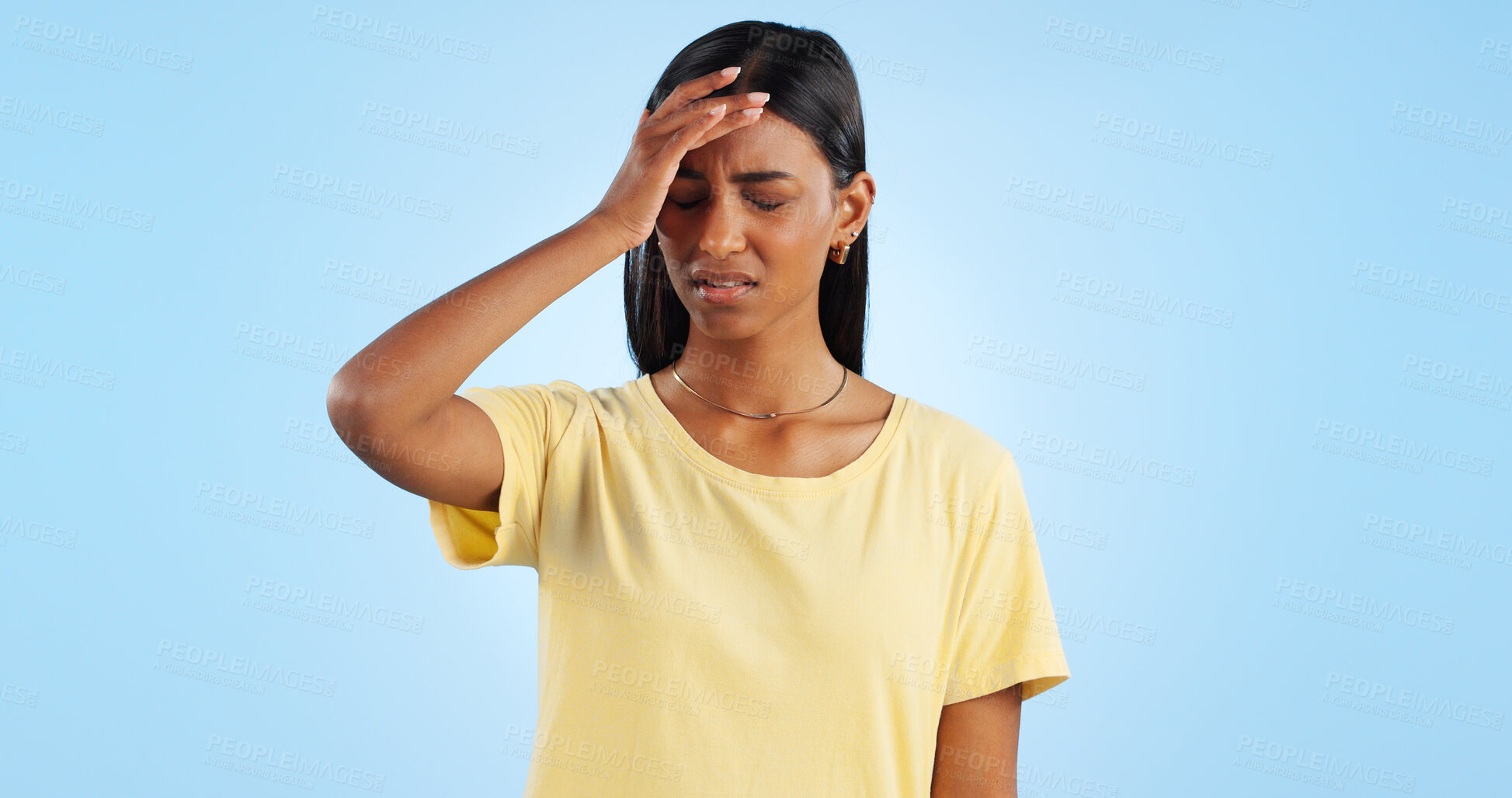 Buy stock photo Headache, pain and stress, woman with fatigue in studio with health emergency and wellness on blue background. Migraine, brain fog and vertigo from medical condition with burnout, sick and tired