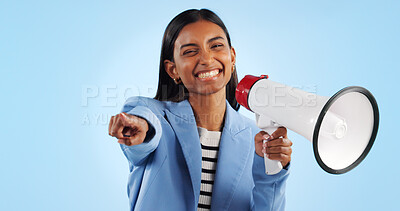 Portrait, pointing to you and woman with a megaphone, business and motivation on a blue studio background. Face, person and consultant with a bullhorn, employee and support with announcement and news