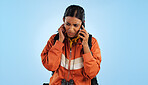 Hiking, cellphone call problem and woman stress over trekking mistake, tour disaster or travel crisis. Listen, smartphone conversation and studio camper with bad network connection on blue background