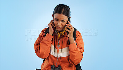 Buy stock photo Hiking, cellphone call problem and woman stress over trekking mistake, tour disaster or travel crisis. Listen, smartphone conversation and studio camper with bad network connection on blue background