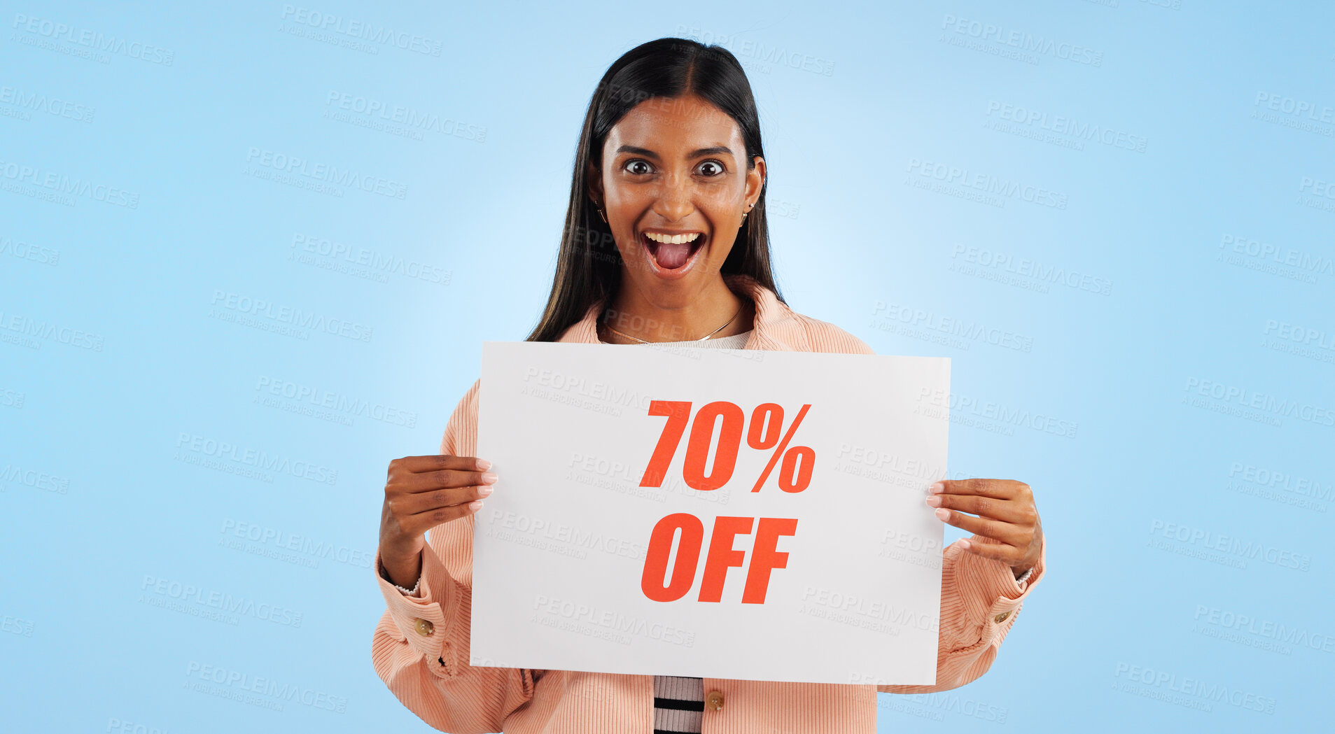 Buy stock photo Woman, promotion poster and portrait with sale, discount and billboard in studio. Excited, smile and happy from savings and deal paper with banner and promo with blue background and price decrease