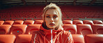 Editorial shot of fit woman posing in stadium. Fitness, sport Concept.
