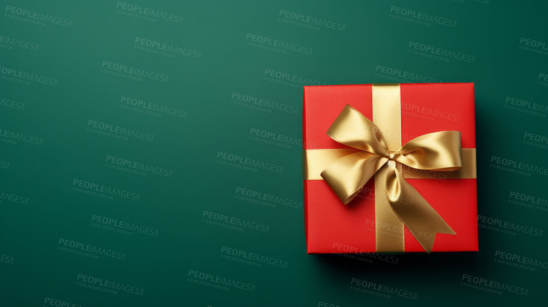 Buy stock photo Red gift box with gold ribbon or bow on a green background. Valentine, Christmas or birthday