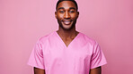 Friendly medical doctor or nurse in pink uniform scrubs on copyspace background.