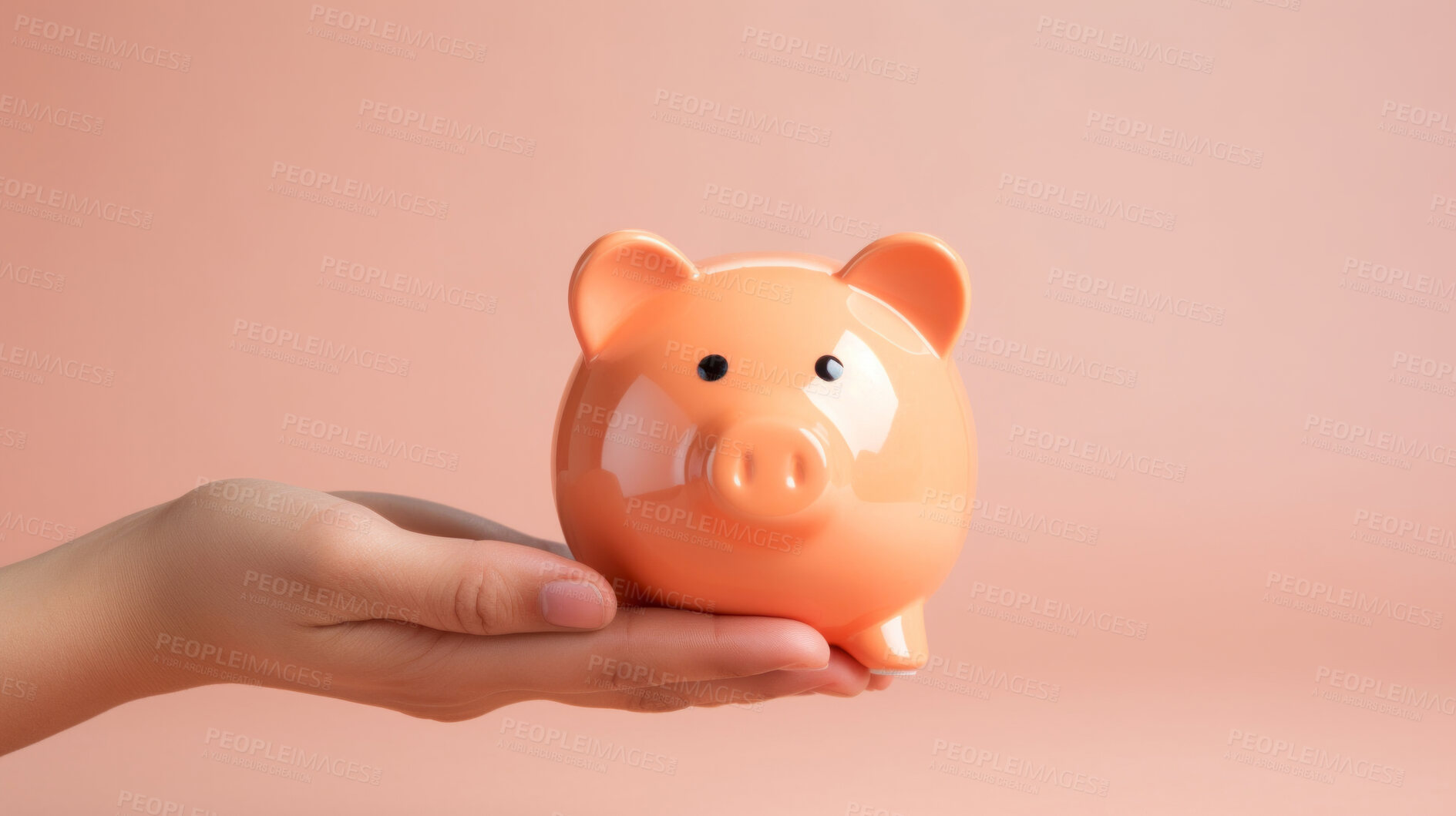 Buy stock photo Hand holding a piggy bank. Savings, budget and money management concept