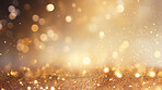 Gold glitter glow particle bokeh background. Festive celebration wallpaper concept