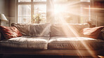 Sunlight on sofa couch in living room. Cozy natural light interior design