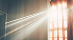 Sunlight through curtain window in home. Peace and spiritual reflection