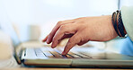 Typing, hands and man with remote work on laptop, desk and closeup on workplace in home. Computer, keyboard and person writing SEO, copywriting or working online with email marketing on the internet