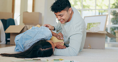 Buy stock photo Home renovation, painting color and playful couple on floor with choice, decision and option for decoration. Interior design, new apartment and man and woman with palette for planning in living room