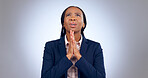 Praying, religion and black woman in a studio for gratitude, forgiveness and hope compassion. Blessing, spiritual and young African female person with prayer hand gesture isolated by gray background.