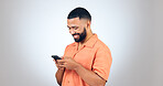 Phone, chat and happy man laugh in studio with online comic, meme or funny text on grey background. Smartphone, smile or male model with app joke, gif or humor, contact or web, humor or communication