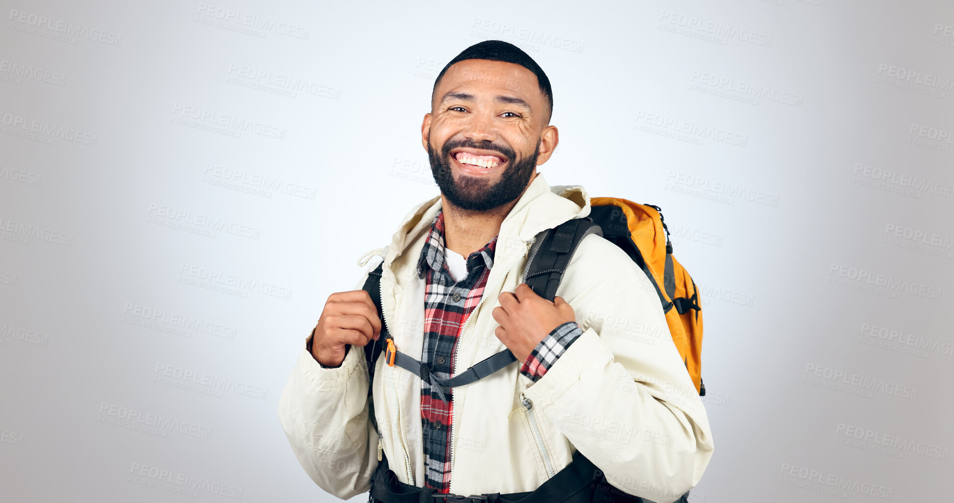 Buy stock photo Man, portrait and hiking in studio with backpack and smile from travel and freedom with adventure. Camping, fitness and grey background and walking with trekking camper gear for vacation and holiday