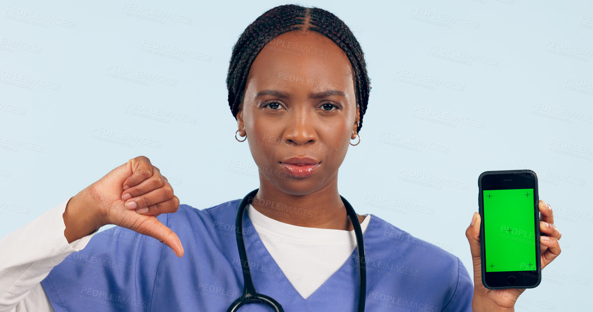 Buy stock photo Phone green screen, portrait and nurse thumbs down in studio isolated on blue background. Smartphone, face and African medical professional with dislike hand sign, health mockup and tracking markers