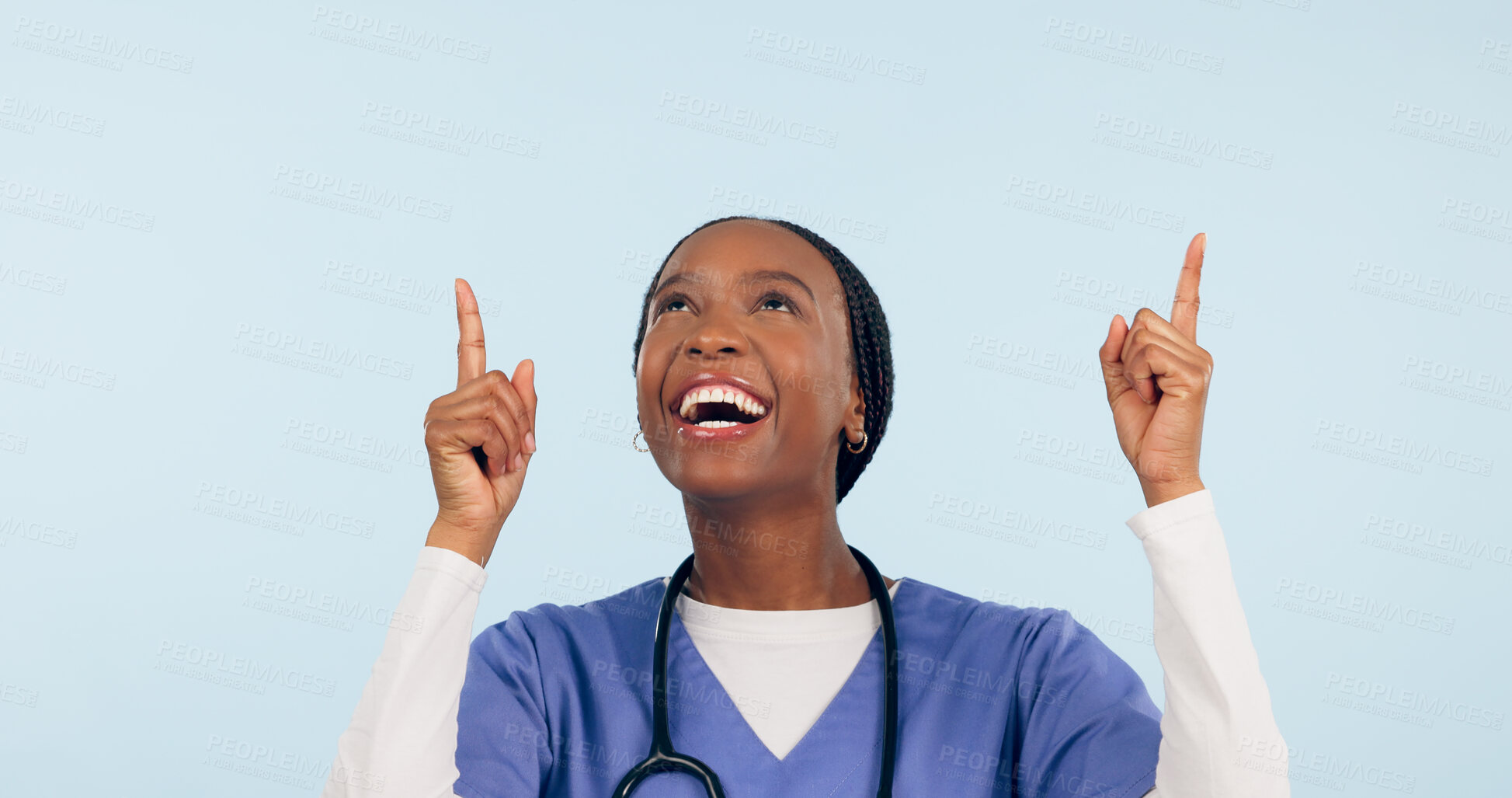 Buy stock photo Smile, announcement and a nurse black woman pointing to space in studio on a blue background for healthcare. Medical, presentation and info with a happy young medicine professional showing mockup