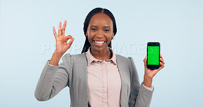 Buy stock photo Business woman, ok sign and green screen phone with portrait for review, choice or app by blue background. African entrepreneur, yes and studio for smartphone mockup, chromakey or tracking markers