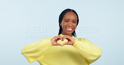 Buy stock photo Portrait, heart and hands of black woman in studio for love, kindness or charity donation on blue background. Happy model show finger sign of hope, care or thank you emoji for support, review or vote