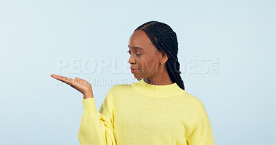 Buy stock photo Woman, palm and advertising space in studio of announcement, mockup or promotion on blue background. African model show hand for presentation of choice, decision or feedback of deal, opinion or offer