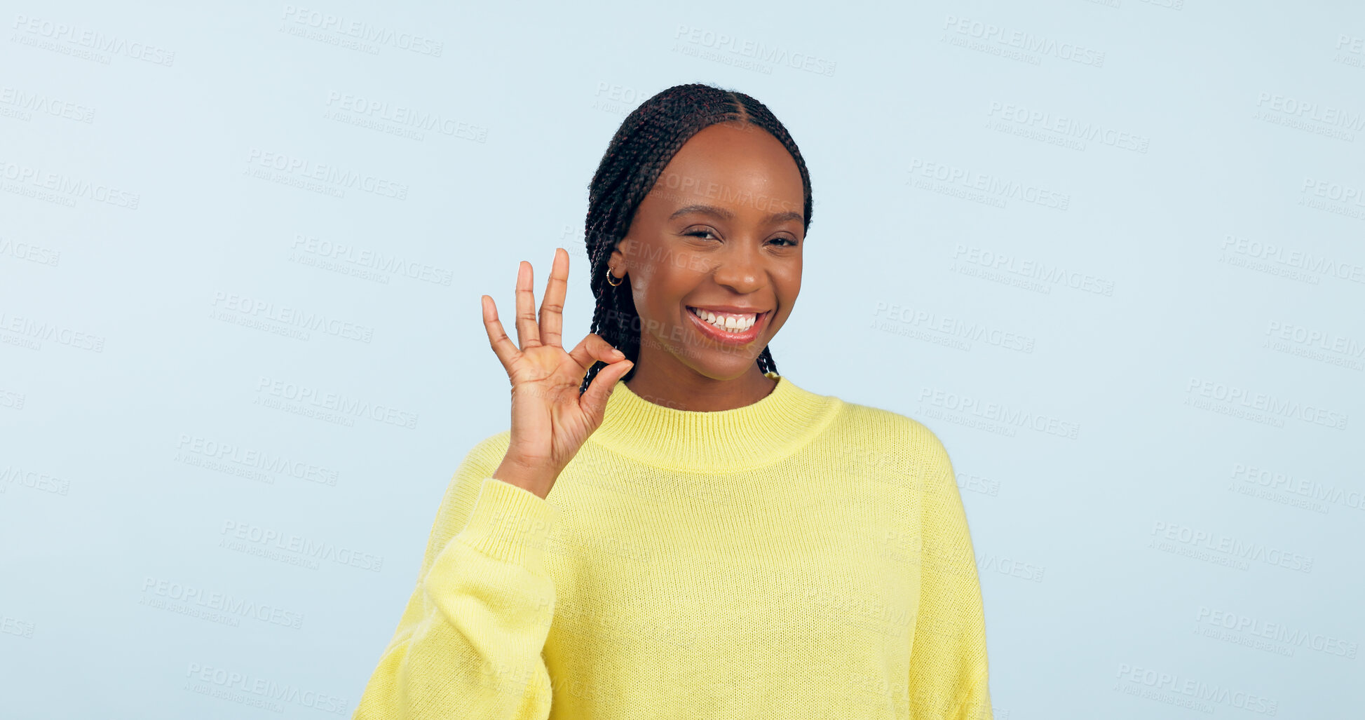Buy stock photo Ok, hands and portrait of woman in studio for certified review, winning feedback or vote yes on blue background. Happy african model show sign of excellence for success, like emoji or icon of support