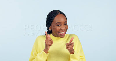 Buy stock photo Happy black woman, portrait and pointing to you in choice or selection on a studio blue background. Face of excited African female person smile for decision or picking with like emoji or yes sign