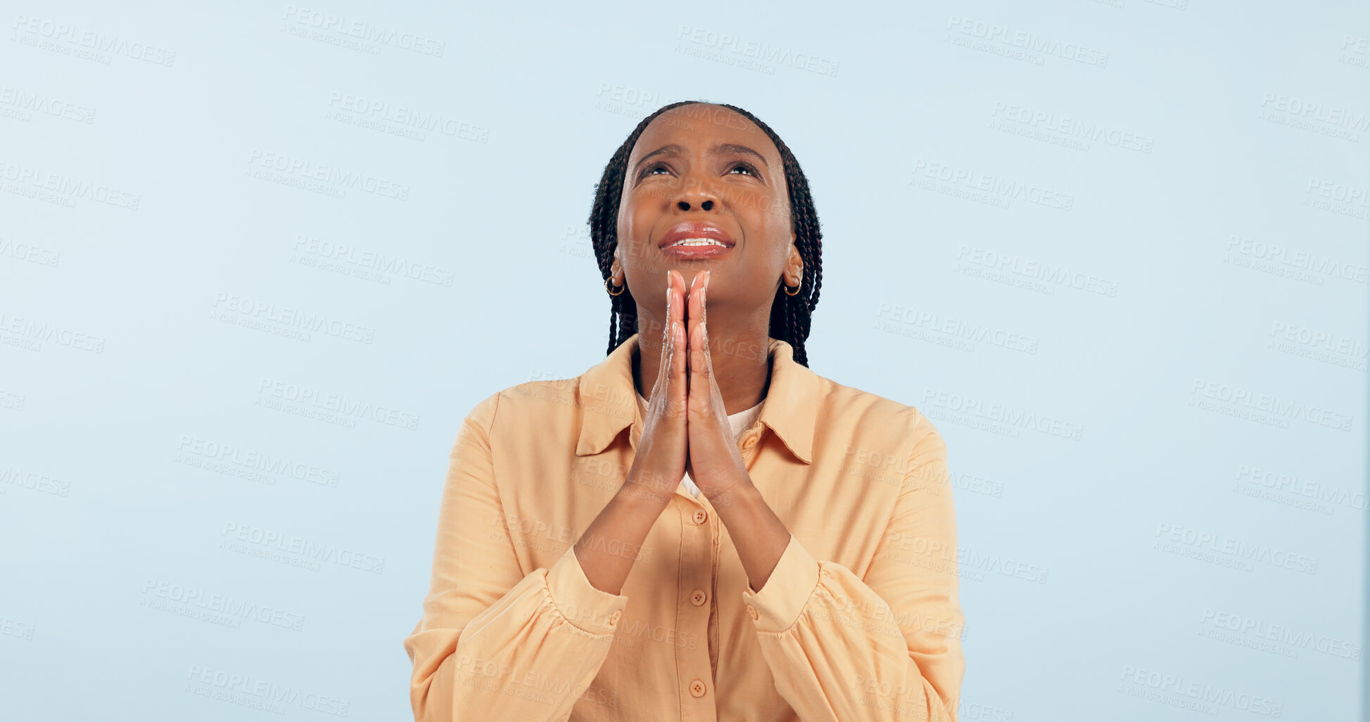 Buy stock photo Black woman, praying and hands in studio with faith, sad or frustrated with question for God by blue background. African girl, prayer and connection to heaven for problem solving, religion and hope