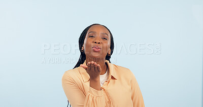 Buy stock photo Love, black woman and blowing a kiss in portrait, studio and blue background with flirting or romance. Lips, pouting and gen z person or emoji with confidence, happiness and mock up space with care 