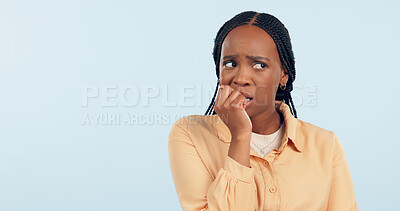 Buy stock photo Woman, anxiety and biting nails in studio for stress, bad habit and thinking of horror on blue background. Nervous african model chewing fingers for terror, worry and scared of fear with mockup space