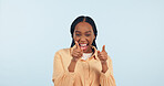 Happy woman, smile and pointing at you with hand in studio for choice, yes or decision in mockup on blue background. African girl, gesture or excited of announcement of new job, hiring or opportunity