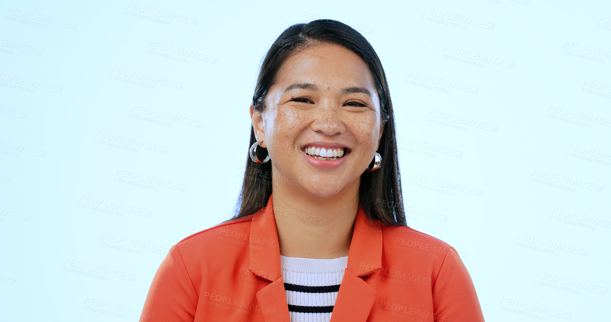 Buy stock photo Happy, headshot and portrait of Asian woman in a studio with positive, good and confident attitude. Excited, smile and closeup face of young female person with happiness isolated by blue background.