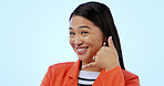 Woman, smile and call me with hand or sign, networking and portrait in studio by blue background. Happy asian model, contact us and emoji for communication, gesture and icon for telephone in mockup