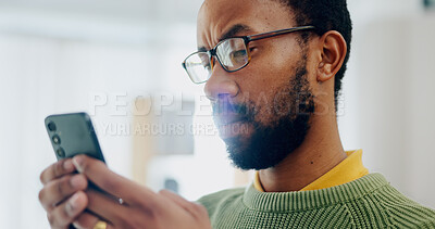 Buy stock photo Communication, house and a black man with a phone for social media, reading chat or notification. Serious, internet and an African person with a mobile for an app, connection or search on the web