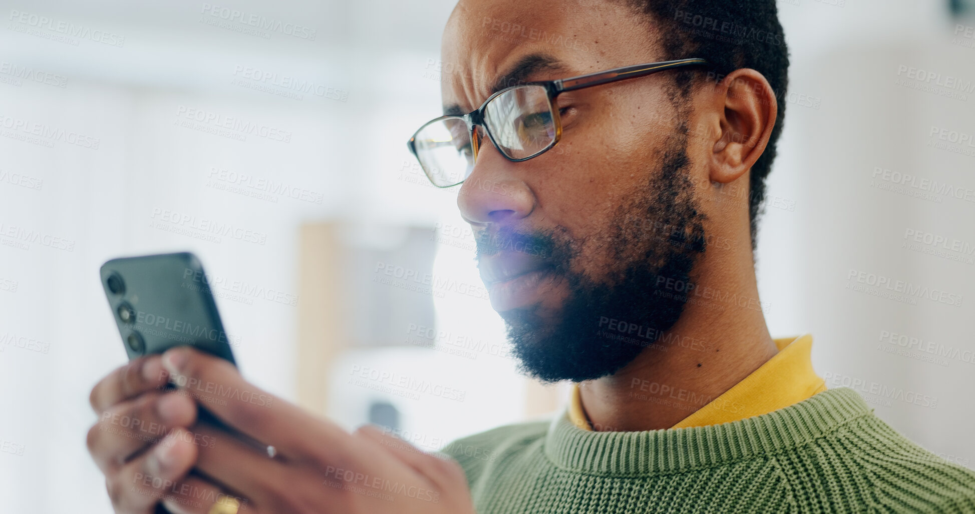 Buy stock photo Communication, house and a black man with a phone for social media, reading chat or notification. Serious, internet and an African person with a mobile for an app, connection or search on the web