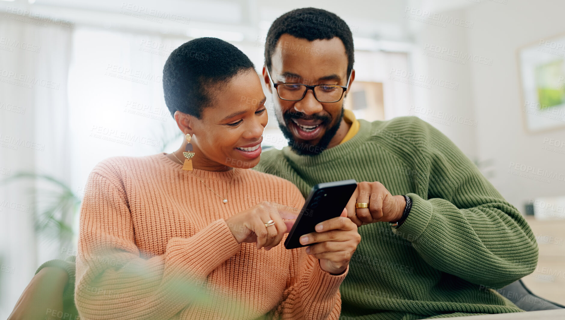 Buy stock photo Phone, happy and black couple on sofa online for social media, internet and browse website. Love, dating and man and woman on smartphone for bonding, relationship and relax together in living room