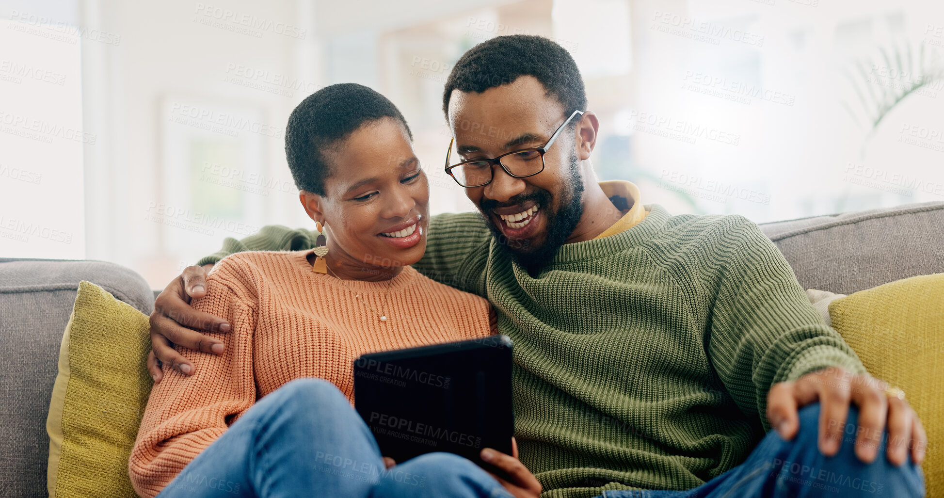 Buy stock photo Happy, home tablet and relax black couple reading, smile or watch social media video, blog or relationship news. Happiness, lounge sofa and African man, woman or marriage people check online website