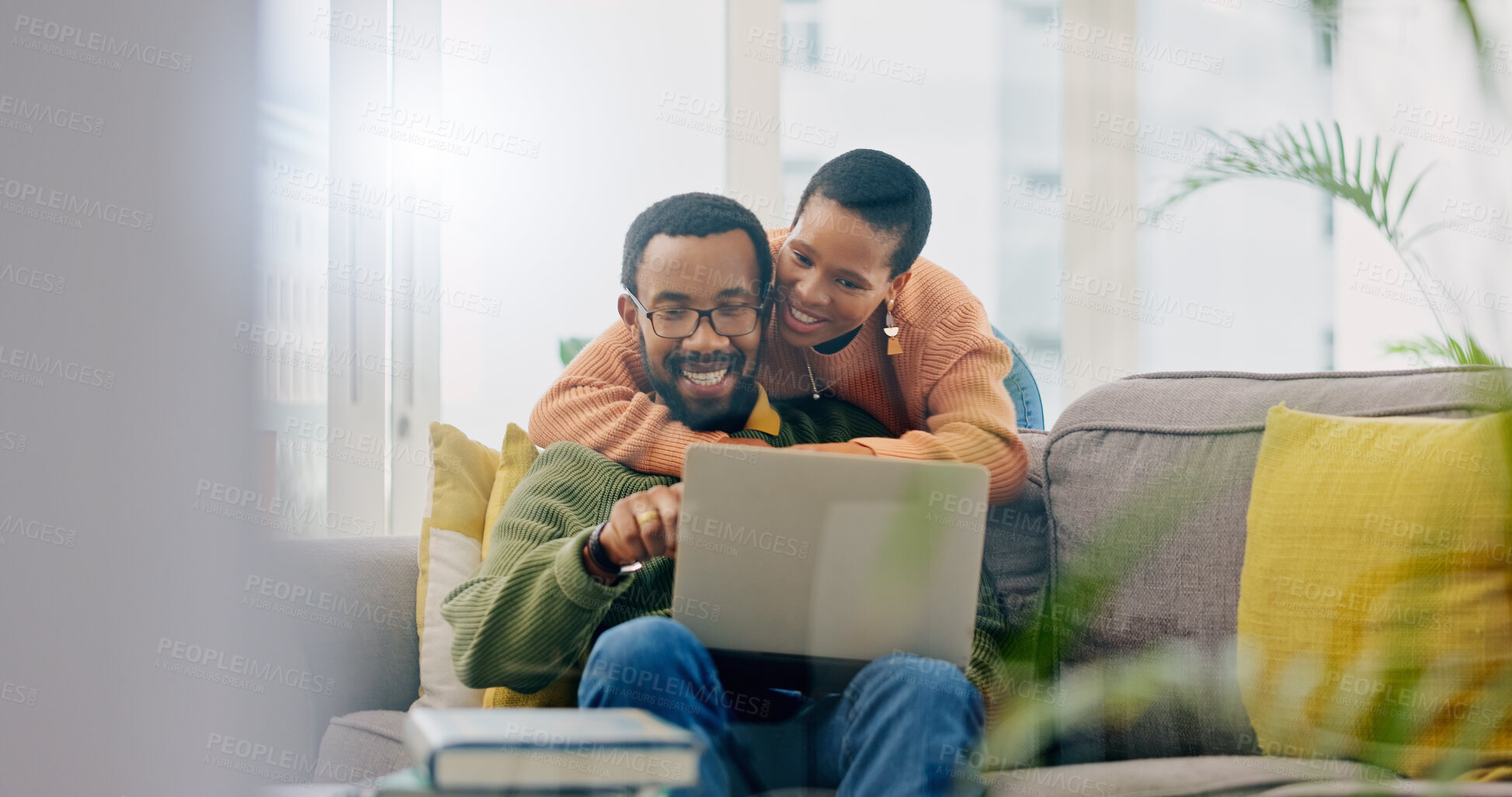 Buy stock photo Happy, couple hug and laptop for social media, internet search or reading an email. Smile, love and an African man and woman with care, connection and a computer for a movie, show or film together