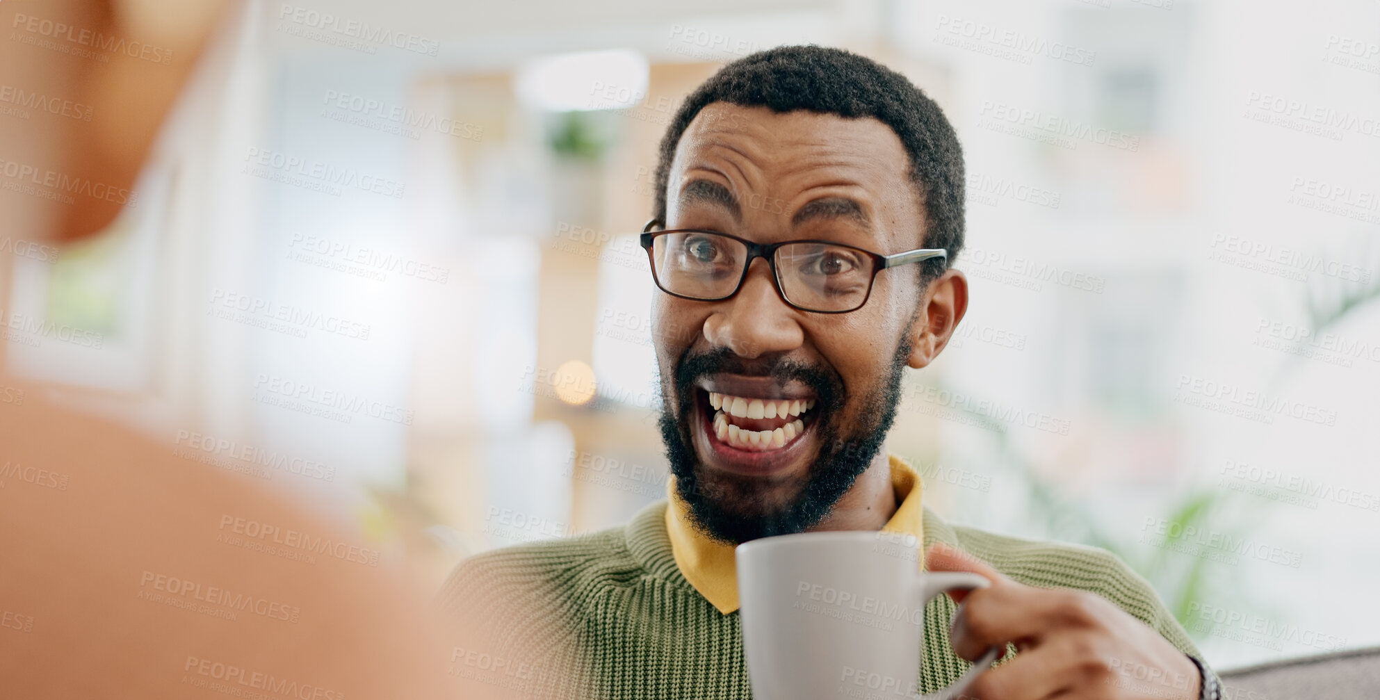 Buy stock photo Coffee, conversation and excited man at home on a living room sofa with a talk and hot drink. Couple, tea and smile with communication and happy together with love and marriage support on a couch